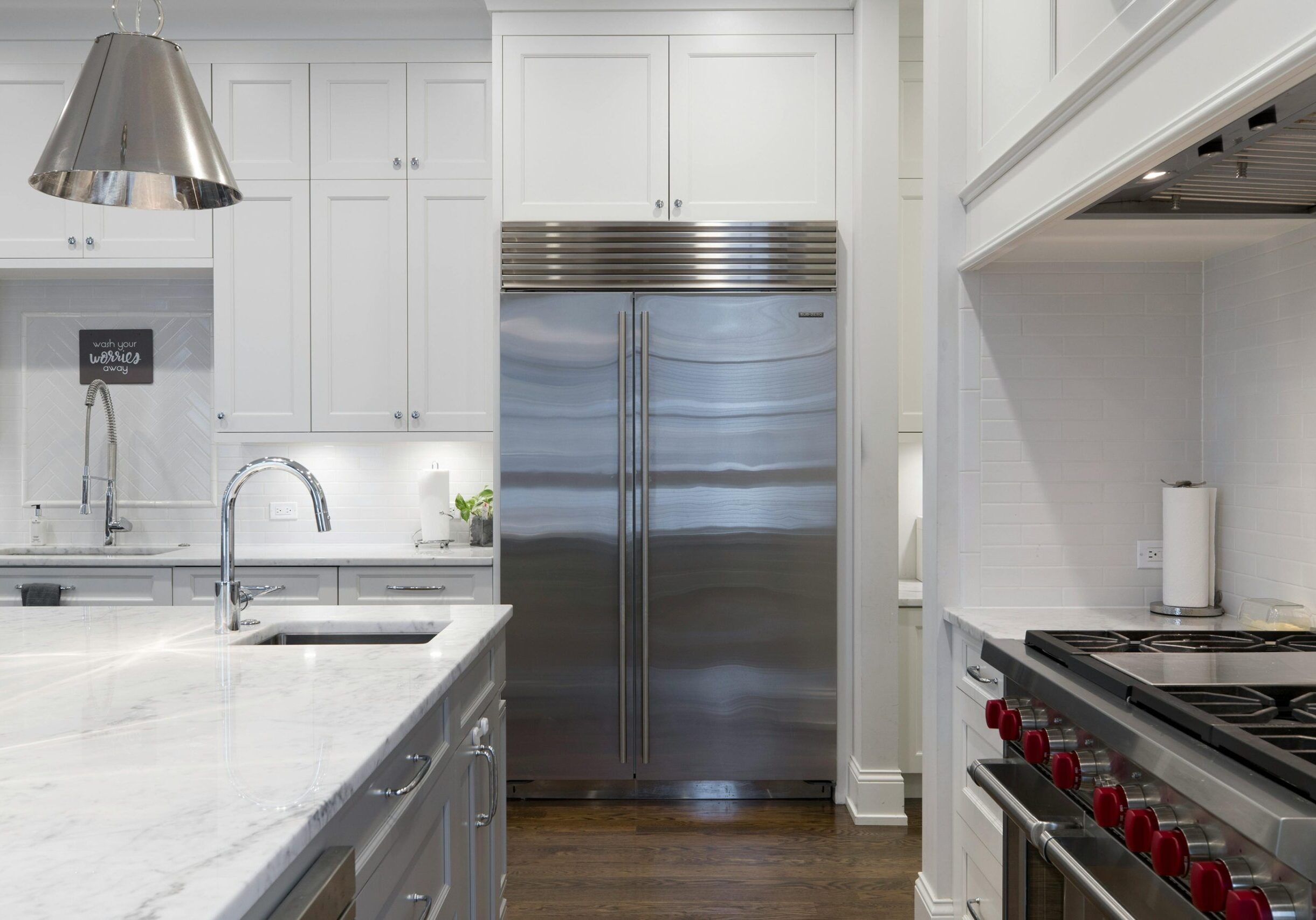 white painted cabinets on white wall